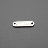 Placa metálica rectangular con grabado La Palma sobre fondo gris