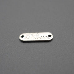Placa metálica rectangular con grabado La Palma sobre fondo gris