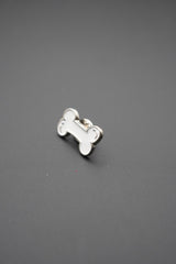 Perfil lateral del pin hueso blanco mostrando grosor y sujeción metálica